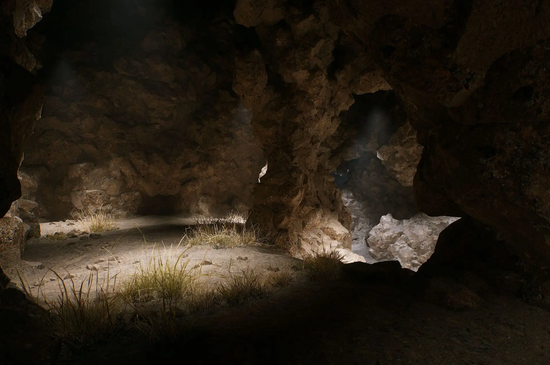 A rocky voxel cave with grass on the floor and light coming in from an opening